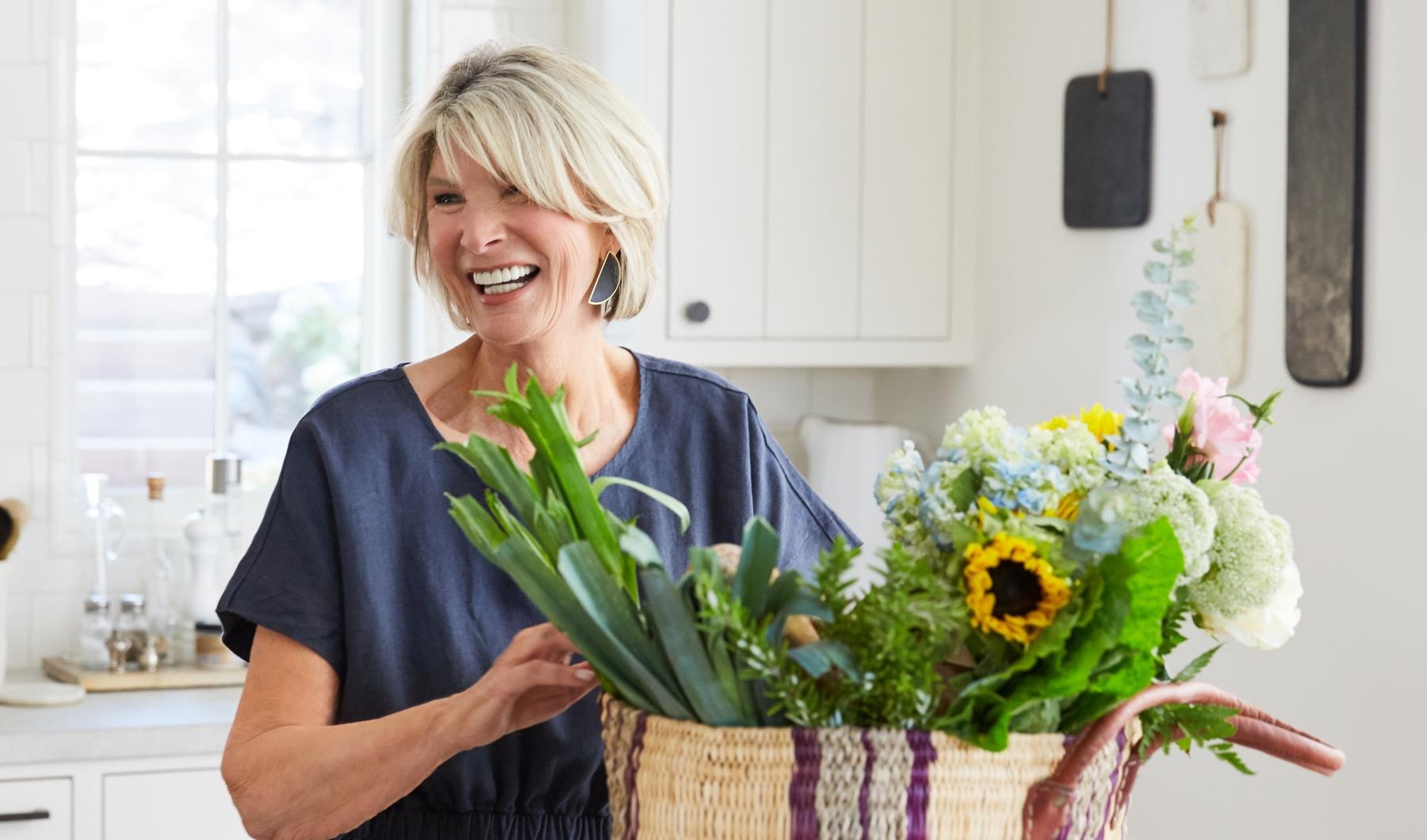 a woman holding a basket of flowers
